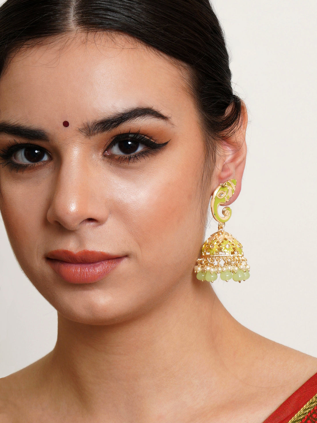 Karatcart Gold Plated Light Green Lord Ganesha Jhumki Earrings for Women