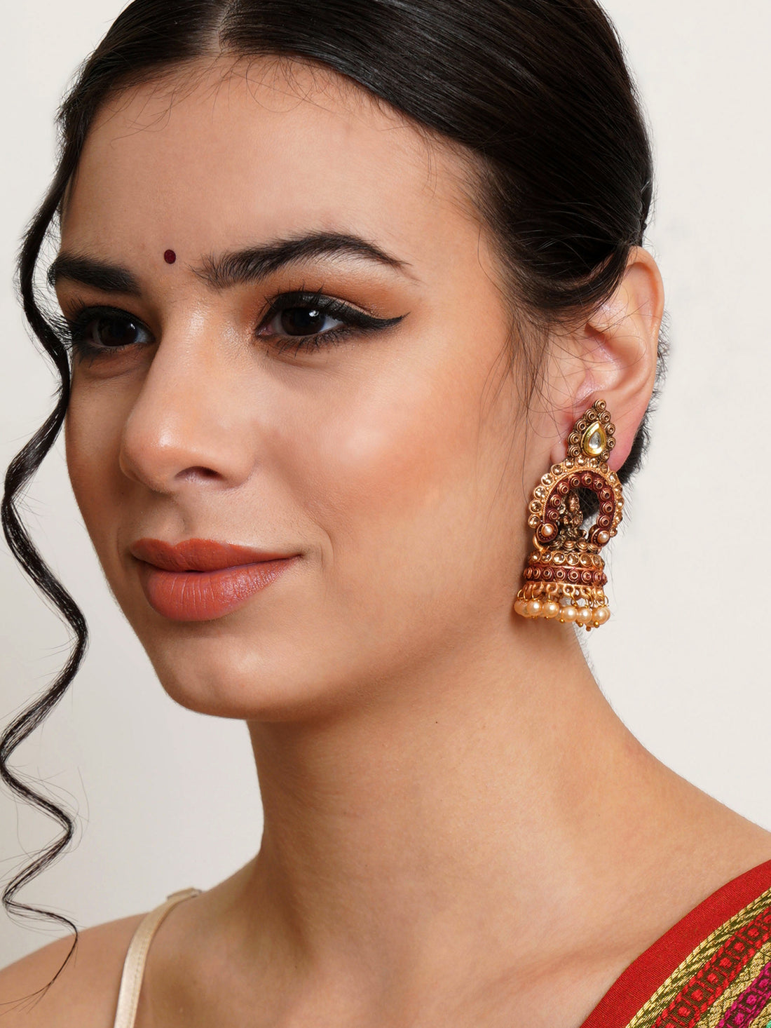 Karatcart Gold Plated Maroon Mata Laxmi Jhumki Earrings for Women