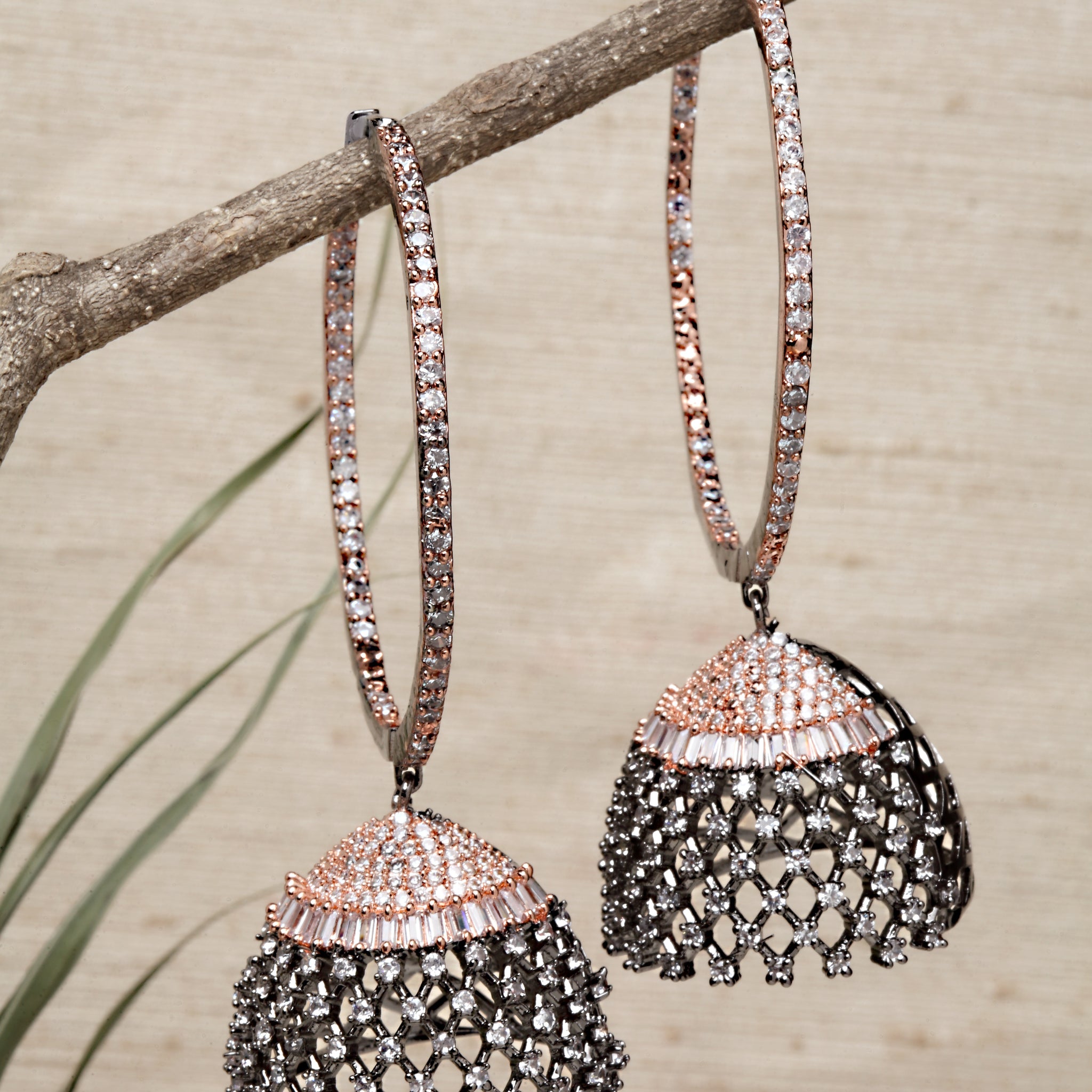 Karatcart Rose Gold Plated Black Finished Cubic Zirconia Studded Jhumki Earrings for Women