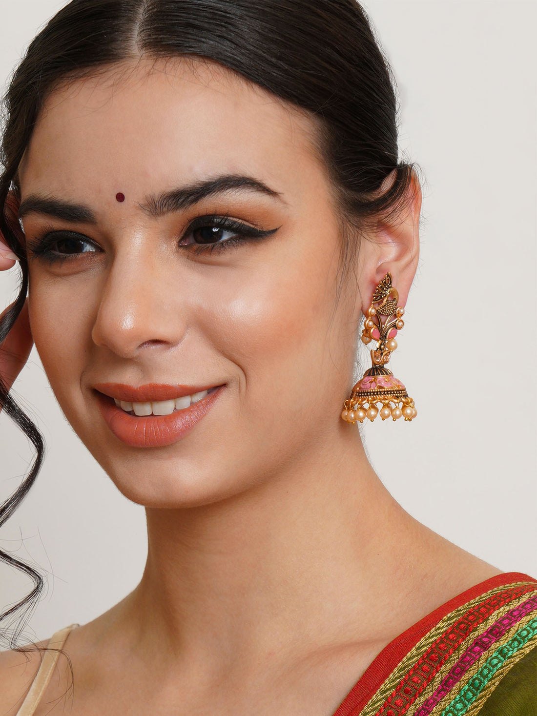 Karatcart Gold Plated Pink Stone Studded Peacock Shape Jhumki Earrings for Women