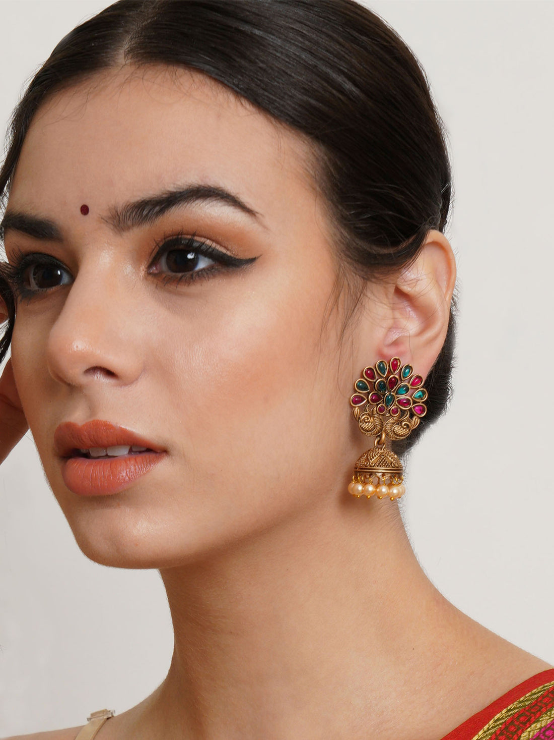 Karatcart Gold Plated Peacock Shape Red and Green Stone Jhumki Earrings for Women